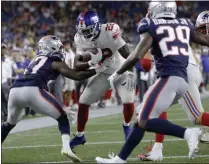  ?? STEVEN SENNE - THE ASSOCIATED PRESS ?? New York Giants running back Wayne Gallman (22) runs for a touchdown in the second half of an NFL preseason football game against the New England Patriots, Thursday, Aug. 29, 2019, in Foxborough, Mass.