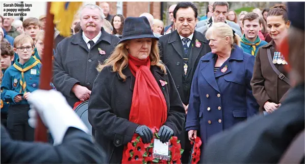  ?? ?? Sarah Dines lays a poppy wreath at the service