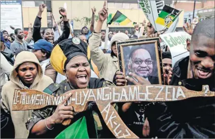  ??  ?? He’s our man: Supporters of Jacob Zuma celebrate outside the high court in Pietermari­tzburg in September 2008, after Judge Chris Nicholson dismissed corruption charges against him, clearing the way for him to become the country’s next president. Photo: Rogan Ward/Reuters