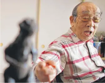  ??  ?? Haruo Nakajima said he invented the character of Godzilla from scratch and developed it by going to a zoo to study how elephants and bears moved.
| JUNJI KUROKAWA/ AP