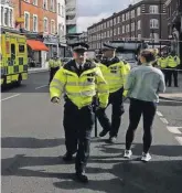  ?? AP ?? London police on patrol after an explosion on a tube train at Parsons Green subway station on Friday.