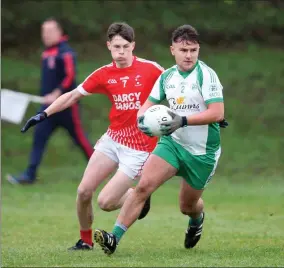  ??  ?? Jason Steed of Shamrocks gets away from Kilaveney’s Daniel Hedderman during the under-20 ‘A’ football championsh­ip semi-final in Tinahely.