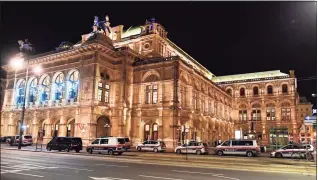  ?? Joe Klamar / AFP via Getty Images ?? Police cars stand in front of the opera house in the center of Vienna on Monday following a shooting. An attack by multiple gunmen in Vienna left at least one person dead and several others wounded late Monday, officials said. One attacker was killed in what security officials were calling a “terror attack.”