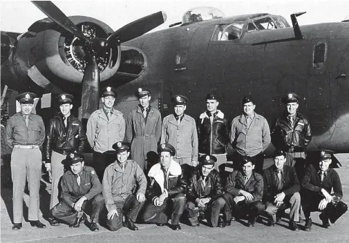  ?? (Photo courtesy of Kevin Stiffler) ?? Capt. James Stewart, Commanding Officer of the 703rd Bombardmen­t Squadron (Heavy), 445th Bombardmen­t Group, with his squadron officers in front of one of their B-24s in England in 1943.