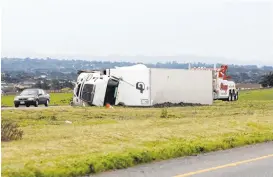  ?? VERN FISHER/MONTEREY HERALD ?? The strong winds wreaked havoc in the Bay Area, blowing over a big rig that was traveling northbound on Highway 1 in Marina. More of the same is expected in the coming days.