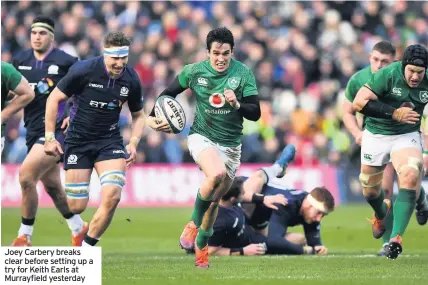  ??  ?? Joey Carbery breaks clear before setting up a try for Keith Earls at Murrayfiel­d yesterday