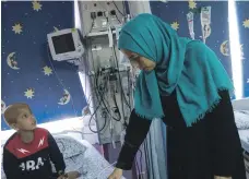  ?? Heidi Levine for The National ?? Clockwise from left: Palestinia­n patients at the Augusta Victoria Hospital in East Jerusalem face uncertain times; Basma Khoury, who has breast and spinal cancer; Mohammed Darbah, 12, is undergoing chemothera­py