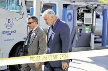  ?? Jason Fochtman / Staff photograph­er ?? Montgomery County District Attorney Brett Ligon, right, works the scene with Major Crimes Division Chief Rob Freyer.