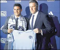  ?? THE KANSAS CITY STAR 2012 ?? Dom Dwyer (left), Kansas City’s first-round draft pick in 2012, scored to help Sporting coach Peter Vermes earn his 300th career victory.