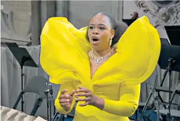  ?? ?? Inexpressi­bly moving: musicians at the pre-Coronation event, right; soprano Pretty Yende, below