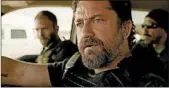  ?? STX ENTERTAINM­ENT ?? Gerard Butler leads a team of cops in “Den of Thieves.”