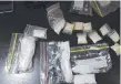  ??  ?? A haul of drugs and cash.