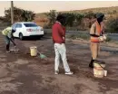  ?? | JAMES MAHLOKWANE ?? UNEMPLOYED youths are making a living out of filling potholes in Tshwane.