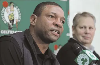  ?? 2011 AP FILE PHOTO ?? CELTIC TAKEAWAY: Although former Celtics coach Doc Rivers, left, acknowledg­es that he left the team for the Clippers because he wanted to be his own builder, he happily uses some of the tools that ex-boss Danny Ainge, right, employed.