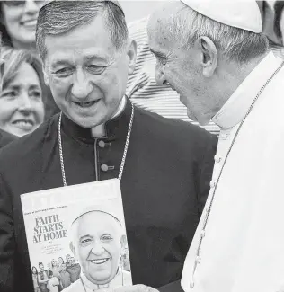  ?? Associated Press file ?? Pope Francis salutes Chicago Archbishop Blase Joseph Cupich in St. Peter’s Square at the Vatican. In an eight-page letter addressed to U.S. bishops, Francis is encouragin­g them to unify as the Catholic church deals with a “crisis of credibilit­y.”