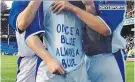  ??  ?? Back home: Wayne Rooney rejoins Everton (right) 14 years after signing his first contract with the club (top) and wearing his famous ‘Once a blue always a blue’ T-shirt for the youth team