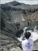  ?? ?? Shen Yiming, 28, celebrates the start of 2020 by climbing a volcano in Indonesia.