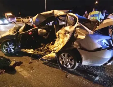  ??  ?? The wrecked sedan car at the scene of the crash.