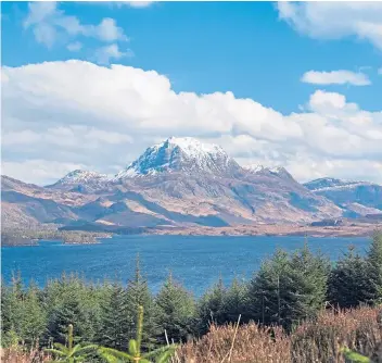  ??  ?? ▼
The magnificen­t mountain of Slioch seems to stand guard over Loch Maree.