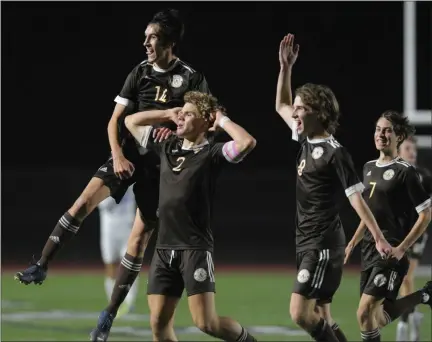  ?? KEN SWART — FOR MEDIANEWS GROUP ?? Jackson Craft (2) celebrates his second goal with teammates Connor Patritto (14), Colton Janes (8) and Matthew Vostriakov (7) during the Division 1 semifinal played on Wednesday, at Troy Athens. The Highlander­s defeated the Rocks, 2-0, and advance to Saturday’s final against Rockford.