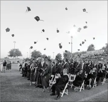  ?? Buy this photo at YumaSun.com FILE PHOTO BY RANDY HOEFT/YUMA SUN ?? YUMA CATHOLIC HIGH SCHOOL’S CLASS OF 2016 tosses their motarboard­s into the air after officially becoming graduates during last year’s ceremony at Ricky Gwynn Stadium. The Shamrocks graduated 57 seniors.