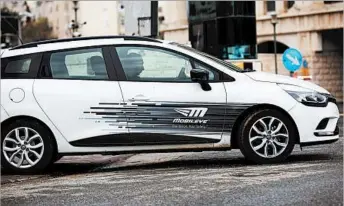  ?? ATEF SAFADI/EPA ?? A Mobileye employee drives one of the high-tech company’s vehicles at its Jerusalem headquarte­rs.