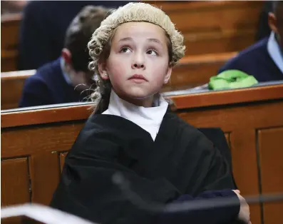  ?? PHOTO: CONOR McCABE ?? Listening: Chloe Jones-Keogh (11) from St Audoen’s National School, Dublin 7, takes part in the mock case of the ‘missing box of chocolates’ as part of the inaugural ‘Justice Week’, which raises awareness about the legal system.