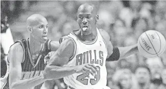  ?? ANNE RYAN/USA TODAY SPORTS ?? Bulls star Michael Jordan, right, is guarded by the Pacers’ Reggie Miller in 1998.