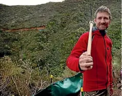  ??  ?? Makara Peak Supporters chairman Simon Kennett at the site where a new bridge will be built in the mountain bike park.