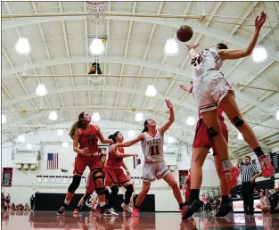  ?? PHOTO BY PIETRO BREZZO ?? Los Gatos’ Olivia Lo, right, jumping for a rebound against Saratoga on Jan. 31, led the Wildcats in scoring in two Central Coast Section playoff games last week.