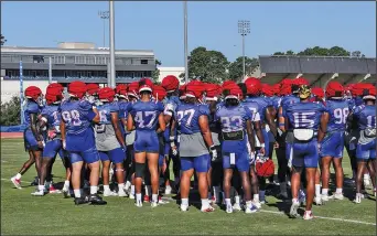  ?? Louisiana Tech Strategic Communicat­ions ?? Meeting: Louisiana Tech’s defense meets during practice earlier this summer in Ruston, La. The Bulldogs are quickly picking up defensive coordinato­r Scott Power's scheme. Louisiana Tech opens the season at Missouri on Sept. 1. Game time is set for 7 p.m.