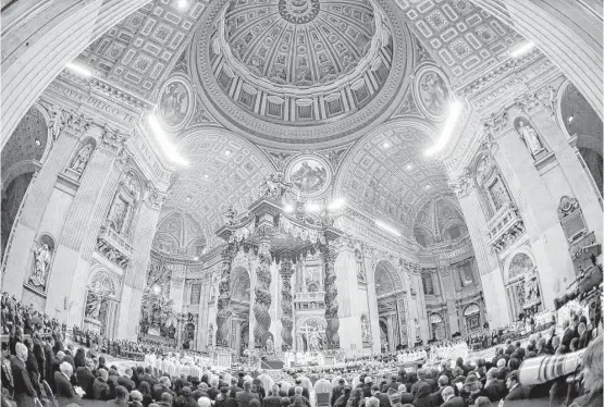  ?? Andeas Solaro / AFP/Getty Images ?? Hundreds of the faithful packed St. Peter’s Basilica in Rome on Saturday to celebrate Christmas Eve Mass with Pope Francis.