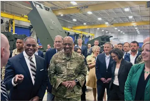  ?? Tara Copp/Associated Press photos ?? Joint Chiefs Chairman Gen. C.Q. Brown, center, tours the HIMARS production line at Lockheed Martin's Camden, Ark., facility on Thursday with Sen. John Bozeman, R-Ark., left. Gen. Brown visited the plant with lawmakers to talk about the need to pass the Ukraine supplement­al and the direct economic impact the spending will have on these local workforces.