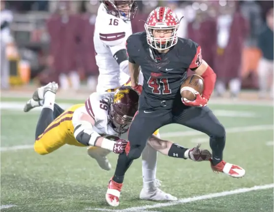  ??  ?? Maine South running back Fotis Kokosiouli­s ( 5- 9, 175 pounds) rushed for 1,275 yards during the 2016 regular season, averaging nearly nine yards per carry. | BRADLEY LEEB/ AP