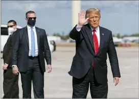  ?? MANUEL BALCE CENETA — THE ASSOCIATED PRESS ?? Former President Donald Trump waves to the members of the media on arrival at Palm Beach Internatio­nal Airport in West Palm Beach, Fla. last week after his departure from Washington, D.C.