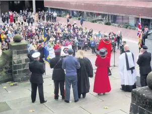  ??  ?? Schoolkids at attention during recent Poppy Remembranc­e Service