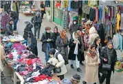  ?? (AFP) ?? Iranian women shop at the bazaar of Tajrish in northern Tehran