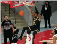  ?? (AP/David J. Phillip) ?? Forward Trey Wade (5) dunks the ball for Wichita State in a game against Houston in January. Wade, who started 21 games for the Shockers last season and averaged a team-best 5.5 rebounds per game, orally committed to the University of Arkansas on Tuesday to become Coach Eric Musselman’s fifth transfer this spring.