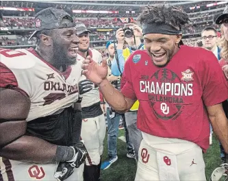  ?? JEFFREY MCWHORTER THE ASSOCIATED PRESS ?? Oklahoma quarterbac­k Kyler Murray, right, celebrates after beating Texas for the Big 12 Conference title.