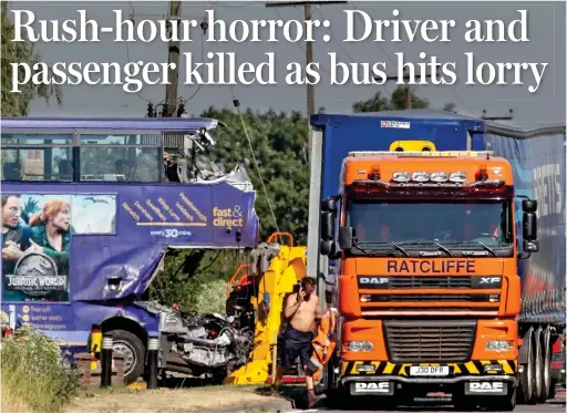  ??  ?? Aftermath: The twisted wreckage of the bus, in which two died, after it smashed into the lorry on the A47 in Cambridges­hire