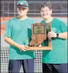  ?? THE BEHREND FAMILY ?? Valparaiso’s No. 1 doubles partners Matt Levenda, left, and Will Behrend celebrate with the Portage Sectional championsh­ip trophy after their three-set win helped the Vikings claim their first since sectional title since 2013.