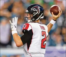  ?? MITCHELL LEFF / GETTY IMAGES ?? QB Matt Ryan led the Falcons down the field to open the game, but a fourth-and-goal run failed, and the Eagles took over on downs.