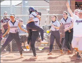  ?? K.M. Cannon Las Vegas Review-journal @Kmcannonph­oto ?? Faith Lutheran players celebrate beating Green Valley in their Class 5A Southern Region championsh­ip game. Both have moved on to the state tournament.