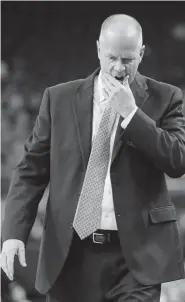  ??  ?? Colorado head coach Tad Boyle reacts after a play against Washington State during the first half on Wednesday night. The Pac-12 cancelled the remainder of the men's tournament on Thursday.