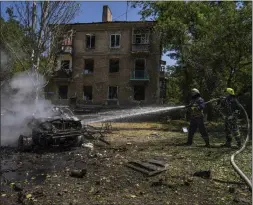  ?? NARIMAN EL-MOFTY — THE ASSOCIATED PRESS ?? Firefighte­rs hose down a burning car after a strike hit a residentia­l area in Kramatorsk in the Donetsk region of eastern Ukraine on Thursday.