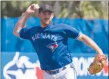  ?? The Canadian Press ?? Toronto Blue Jays starting pitcher Joe Biagini throws out Philadelph­ia Phillies’ Cameron Rupp at first base during first-inning spring training action in Dunedin, Fla., on Friday. The Jays won 2-1.