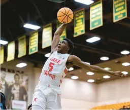  ?? KENDALL WARNER/STAFF ?? Lake Taylor’s Shahide Battle goes up for a dunk during a Class 3 Region A semifinal last week. His team plays host to Meridian of Falls Church tonight.