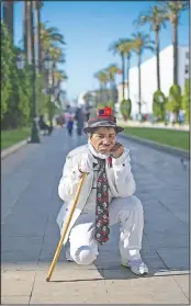  ??  ?? Abdelsalam performs on a main avenue in Rabat.