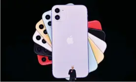  ??  ?? The iPhone 11 comes in a range of new colours, has a new dual-camera system and better battery life. Photograph: Josh Edelson/AFP/Getty Images