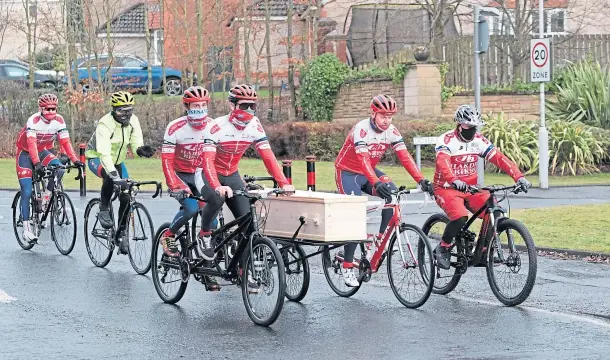  ??  ?? ONE LAST RIDE OUT: Dozens of friends pedalled behind the cycle hearse for the funeral which was held at Dunfermlin­e Crematoriu­m.